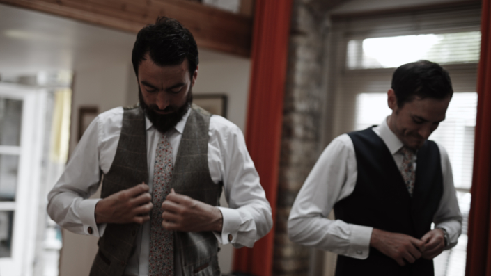 putting wedding vest