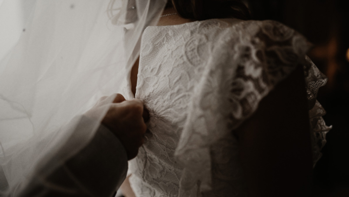 Natascha putting wedding dress